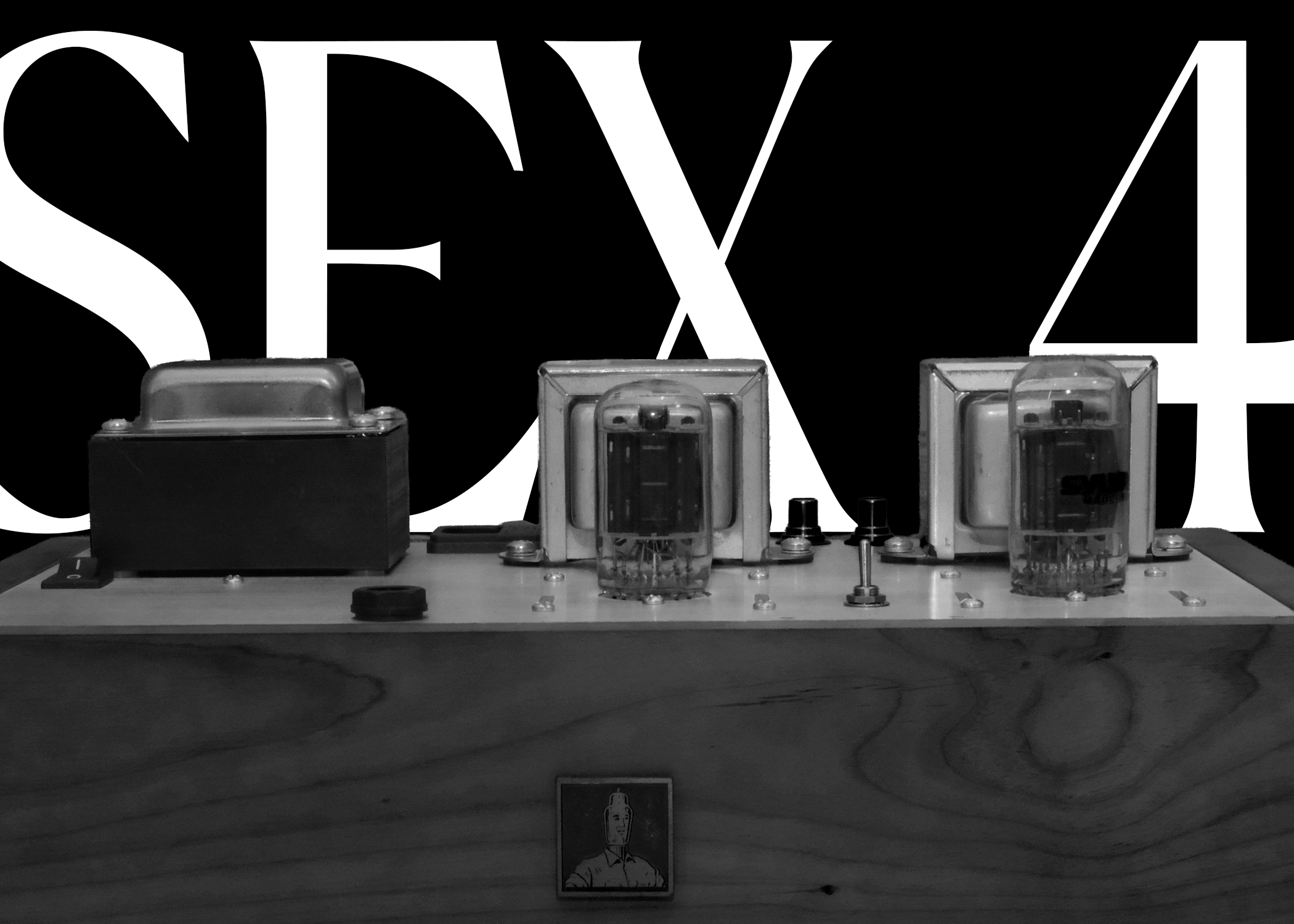 Black and white image of the SEX 4 amplifier with 'SEX 4' text.